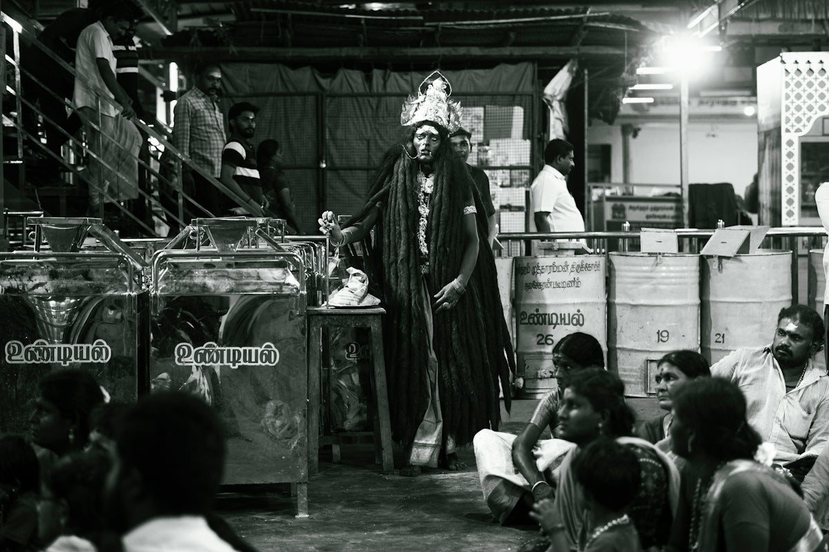 A black and white photo of people in a warehouse