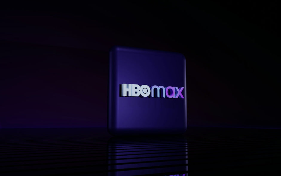 Hbo max logo on a dark reflective surface